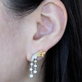 © イリーシージュエリー / Ery,C Jewelry / Eryc Jewelry / erycjewelry / eryc jewelry。夜sora（夜空）コレクションの星 ピアスとコメットと三日月 リング。天の川と流れ星、三日月と星をモチーフにしたハイジュエリーで、天然のカナダマークダイヤモンド（CanadaMark™ ハート＆アロー・ラウンドブリリアント）0.6ct、天然サファイア0.7ct、天然タンザナイト（カボション）3ct、天然ダイヤモンド0.3ct、プリンセスカットダイヤモンド0.6ct、ファンシーライトイエローダイヤモンド0.7ct、天然サファイア0.6ctを使用。Comet star earrings and moon ring from the Ery,C Jewelry Yozora collection, featuring natural CanadaMark™ hearts and arrows diamond, sapphire and tanzanite with milky way motif.